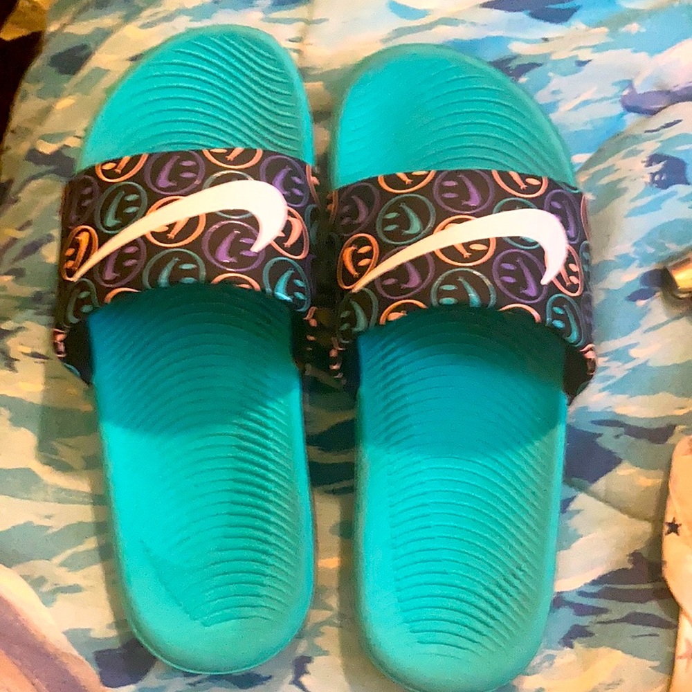 Nike slides, teal and black in color